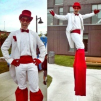Stiltwalker Toronto white and red tuxedo stilts performer entertainment Canada 150