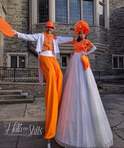 Hala on stilts orange costumes Stiltwalkers Casa loma