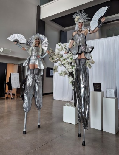 Hala on Stilts entertainment Stiltwalkers Toronto Chrome silver pair