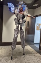 Stilt-walker Silver Toronto Hala on stilts Cosmic Chrome